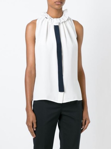 VICTORIA BECKHAM lace collar tie blouse – as worn by Storm Keating at the Julien MacDonald S/S 2016 show at LFW. Celebrity fashion | designer tops | sleeveless blouses | ruffle collar