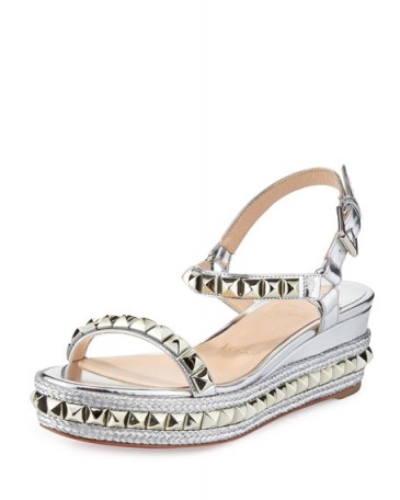 Christian Louboutin Cataclou Metallic Studded Red Sole Sandal, Silver. Summer wedge sandals | holiday chic | stud embellished shoes | designer wedges