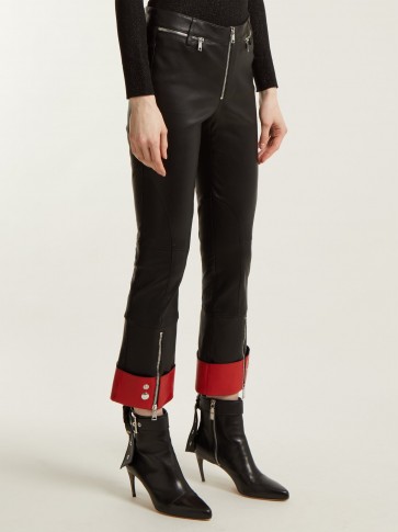 ALEXANDER MCQUEEN Cropped black leather red hem biker trousers