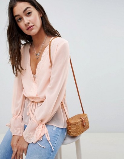 ASOS DESIGN sheer wrap top with lace trims in pink