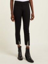 ANN DEMEULEMEESTER Lace-cuff slim-leg black wool trousers