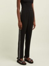 CHRISTOPHER KANE Crystal-embellished high-rise trousers in black