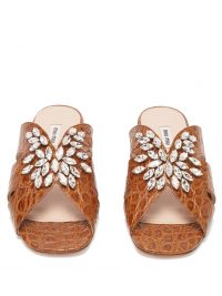 MIU MIU Embellished crocodile-embossed leather slides in brown | crystal summer flats