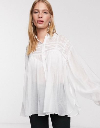 Ghospell oversized shirt with statement sleeves and pleated detail in off white