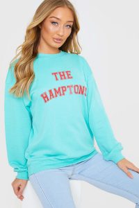 MEGGAN GRUBB GREEN “THE HAMPTONS” VARSITY OVERSIZED SWEATSHIRT – slogan sweat tops