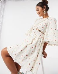 ASOS DESIGN all over embroidered mini skater dress with lace trim in cream / wide sleeve fit and flare