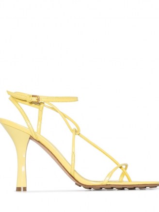 Chrissy Teigen strappy heels on Instagram Stories, 19 August 2020, Bottega Veneta yellow 90 leather sandals | celebrity social media footwear | star style shoes