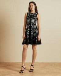 TED BAKER NAOMYY Rhubarb jacquard knitted skater dress in black / sleeveless fit and flare dresses – floral lbd