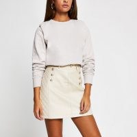 River Island Stone PU quilted mini skirt – neutral button detail skirts – faux leather fabrics