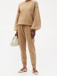 ROKSANDA Ponza drawstring-waist knitted track pants / beige soft knit joggers with a patch pocket detail and striped cuffs on the hem. Perfect for a sports luxe look.