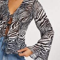 RIVER ISLAND Black zebra print tie front blouse / flared sleeve blouses