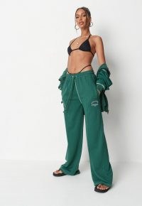 jordan lipscombe x missguided green athleisure wide leg joggers ~ logo jogging bottoms