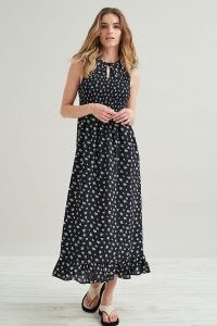 Kirei Smocked Maxi Dress / black floral sleeveless dresses with frill hem and front keyhole cut out