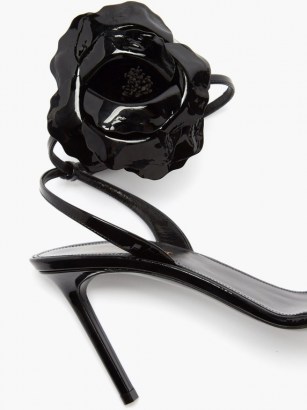 SAINT LAURENT Amber flower-corsage black patent-leather sandals / floral high heels