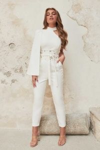 Lavish Alice high neck cape jumpsuit with corset belt in white | one shoulder fitted waist jumpsuits