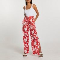 RIVER ISLAND Red floral wide split leg trousers / side slit leg