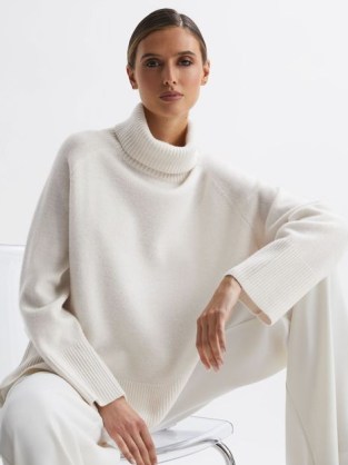 Reiss EDINA RELAXED CASHMERE FUNNEL NECK JUMPER in CREAM | chic oversized raglan sleeve jumpers