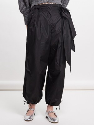 Simone Rocha Rose-appliqué nylon trousers in black ~ women’s relaxed floral detail cuffed hem trouser