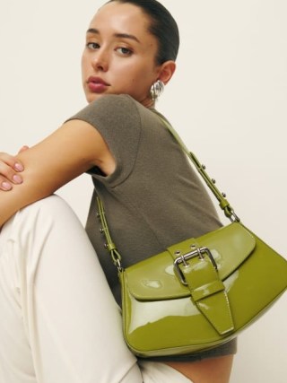 Reformation Rafaella Shoulder Bag in Salamander Patent | luxe handbags | glossy green leather bags | front buckle detail