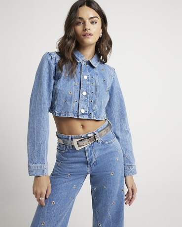 River Island Blue Eyelet Detail Cropped Denim Jacket | women’s casual crop hem jackets with cutout details