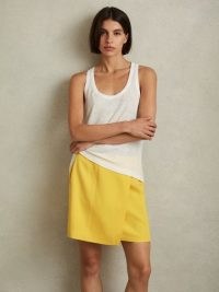 REISS CLEO CROSS-OVER MINI SKIRT in YELLOW – wrap style skirts