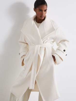 REISS Evelyn Atelier Blindseam Wool And Cashmere Coat in Cream ~ chic off white tie waist wrap coats ~ women’s luxe outerwear for winter 2024 / 25