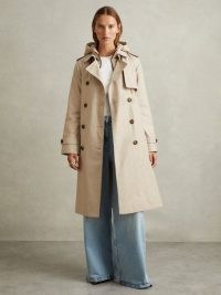 Reiss Azura Double Breasted Hooded Insert Trench Coat in Stone | women’s neutral tie waist longline coats