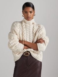 Reiss Aubrey Atelier Wool and Cashmere Cabled Jumper in Cream | women’s chunky high neck cable knit jumpers | luxe relaxed fit soft feel sweater