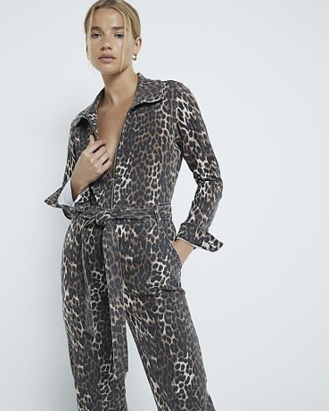 River Island Brown Leopard Print Denim Jumpsuit | women’s front zip up tie waist jumpsuits with animal prints