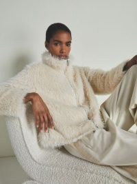 Reiss – Les 100 Ciels Cameron Faux-Fur Coat in Cream | fluffy luxe style zip up jacket | women’s short length winter coats