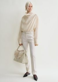 TOTME Funnel-neck organza blouse ecru ~ contemporary minimalist clothing ~ oversized long sleeve high neck top